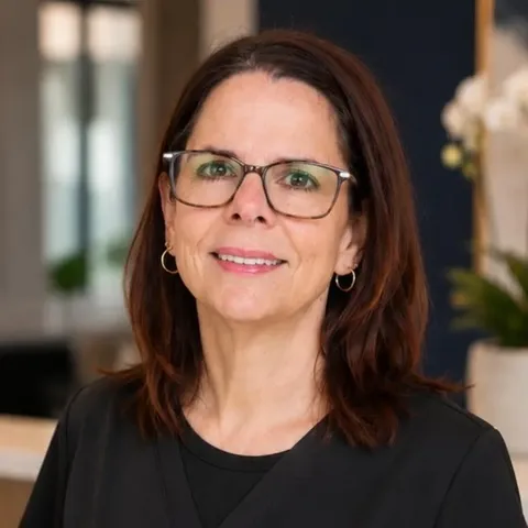 Cherie Schexnaydre, Receptionist
